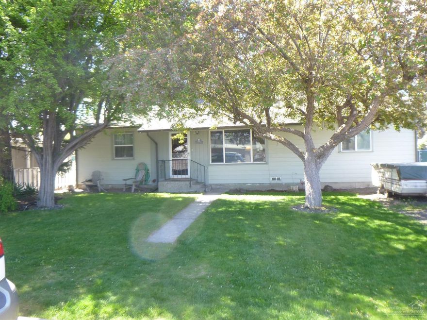 Pride of ownership shows in this well cared for 4 bedroom 2 bath home, could possibly be two master bedrooms. Only a very small poration of the home is the original 1957 home, it has been added on and remodeled. Large open kitchen with Hickory cabinets and a nice family room makes for great room living. Nice deck w/ French doors going out to it for summer evenings BBQ's. Fenced back yard and corner lot allows for privacy. Irrigation well for watering lawn. Located in a great area close to schools and parks.