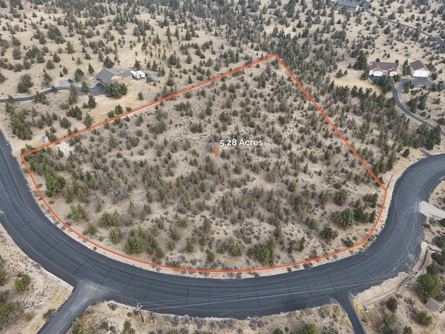 Discover the ideal canvas for your dream home on this stunning 5-acre lot in Longhorn Ridge Estates! Just a short 10-minute drive from downtown Prineville, this parcel features a gentle slope, perfect for crafting a captivating split-level or terraced design. Nestled within a secure gated community, the property has utilities stubbed to the lot, an existing well, and confirmed septic feasibilityâ€”offering a seamless path to immediate development. Embrace tranquil views and a lifestyle of privacy and convenience in this exceptional location.