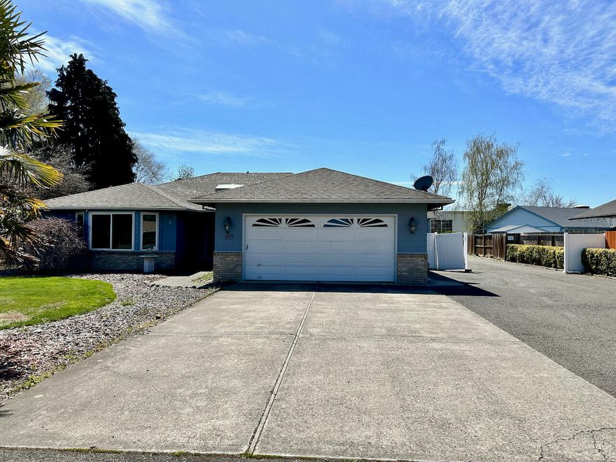 **Priced BELOW recently appraised value** Don't miss the great opportunity to restore this property to its full potential! Plenty of room for all of your toys on the large .47 acre lot with a huge shop out back! The home has a spacious master suite with a walk-in closet, jetted tub, step-in shower, and sliding door to the patio; 2 guest bedrooms; guest bathroom, living room with woodstove; kitchen with granite counters and breakfast bar; dining area overlooking the back yard; built in desk area with tons of storage space just off the kitchen; laundry room; and a 2 car garage. The shop has a 2 car garage, 2 bathrooms, an office area, a large flex room, and a loft area conversion in the RV garage space. Schedule a showing today!