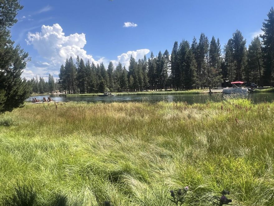 Build your dream retreat in the heart of Oregon Water Wonderland! This rare riverfront lot offers the perfect blend of natural beauty and modern convenience. With mature Ponderosa pines providing shade and serenity, this buildable parcel is ready for your vision - featuring community water, sewer, and paved road access. Located on the banks of the Big Deschutes River, enjoy fishing, kayaking, and peaceful evenings by the water just steps from your future front door. Easy year-round access makes it ideal for a full-time residence or vacation getaway. Low annual HOA dues $300 help maintain the beauty and functionality of this sought-after Central Oregon community. Don't miss your chance to own a slice of riverfront paradise surrounded by nature, yet close to everything Sunriver and Bend have to offer.