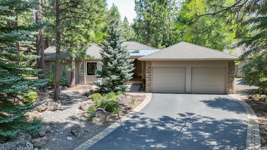 This sought-after Nat'l Forest setting is a MUST SEE!  This custom-built single level home is in a quiet North end location. Meticulously maintained w/ thoughtful updates. The open great room layout includes a stacked stone wood burning fireplace insert & vaulted ceilings, skylights & expansive views of the Nat'l Forest. Beautiful walnut hardwood flooring flows through the main areas. Updated kitchen includes granite counters, stainless appliances, cabinetry & eating bar. The spacious primary suite is nicely separated from guest bdrms & offers forest views & a spa-like bathroom with jetted tub, tile shower, dual sinks & walk-in closet. Three add'l guest bdrms & full bath complete the single-level home. Two car garage w/ attic storage & bonus greenhouse. An extra storage shed provides an area for your toys. Take the party outside & enjoy the wrap around redwood deck. Central Vac, A/C, 50-yr roof, tankless HWH, Milguard windows, solid wood doors throughout, Smart Technology. SHARC paid!