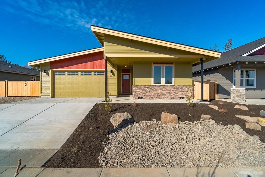 Modern shed style home w/a touch of rustic charm in NW Redmond's Canyon Rim Village. The Titan plan by Dunlap Fine Homes offers an inviting covered entry way leading to a spacious Great Room style layout. Vaulted ceiling, cozy gas burning fireplace adorns the corner & an open Kitchen w/working island. Quartz slab counter tops, farm style undermount sink, SS appliances & gas range make for a great culinary opportunity! Enjoy a quick meal at the breakfast bar or a dinner w/friends in the adjoining dining area. This summer take the entertaining outside to the patio & lawn. Extended Master Suite is lg enough for extra seating while you enjoy a bit of downtime. Oversized closet off of the Master Bath, complete w/double vanities, step in shower & Luxury Vinyl Plank flooring. A/C installed + Front/back landscaping + fully fenced!<br>