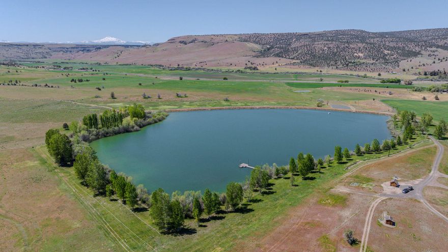 Willowdale Ranch offers a rare chance to own 13,324± deeded acres in the American West, combining legacy, recreation, and agriculture. With 564± acres of irrigation water rights and supplemental wells, it's a productive cattle and hay ranch. A 20± acre private lake enhances its appeal with trophy Bass fishing. Outdoor opportunities abound—world-class elk, deer, antelope, Aoudad sheep, turkey, upland birds, and waterfowl hunting, plus steelhead fishing access. The property qualifies for 6 LOP tags each for elk and deer. Improvements include four homes, four remote cabins, rodeo grounds, trap and skeet range, and full guest amenities. Whether expanding ranching, building a multigenerational retreat, or creating a sporting destination, Willowdale delivers unmatched scale, resources, and natural beauty.