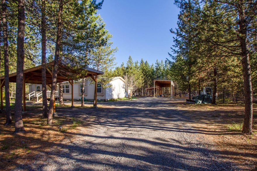 Looking for space...wow this property has a lot to offer. Fenced & gated, lots of covered areas. Big back deck for great outdoor living space. Large kitchen with lots of storage. Great value! Call to make your appointment today!