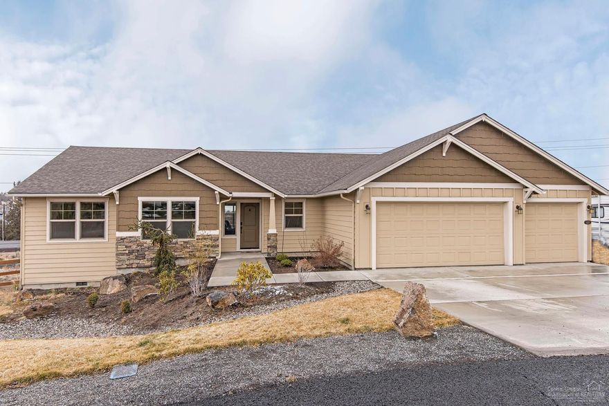 Beautiful single level home on a half acre in Terrebonne's desirable Angus Acres neighborhood! This home features a great, open floor plan, vaulted family room ceilings, cozy fireplace and a large custom kitchen with an expansive island, custom cabinetry, granite counters, a large pantry and stainless steel Whirlpool appliances. The large master bedroom leads into a grand master bath, through the sliding barn door with dual vanity, tiled soaking tub, separate tiled shower and walk-in closet. Comes with a den/office or third bedroom, large laundry room with folding counter, large back deck with mountain views, custom made graveled RV parking area and much more.