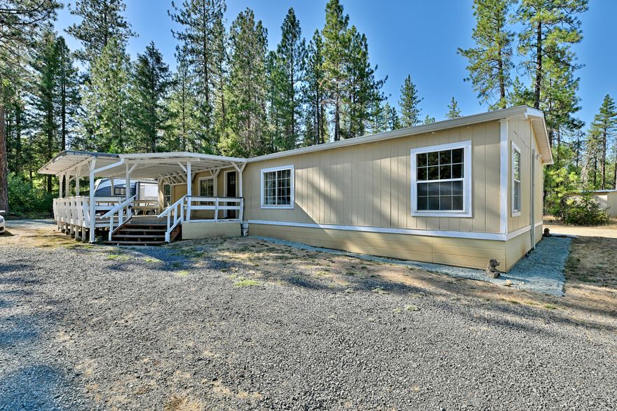 Welcome to your dream retreat! This nicely updated manufactured home, built in1991and thoughtfully refreshed in 2023, offers country comfort living. Step inside to discover a generous living space measuring 1620 sq. ft, perfect for entertaining or relaxing with loved ones. Included is three spacious bedrooms and two full baths, this home is ideal for families or anyone looking for extra space. The detached garage was recently converted to an office/workshop. With it's spacious layout it has potential for providing an additional living space. This home is situated on a expansive 2.61 acre lot, providing plenty of room for outdoor activities and privacy while remaining conveniently close to the road. Don't miss the opportunity to own a home in Rogue River. Schedule a showing Today! SOLD AS IS