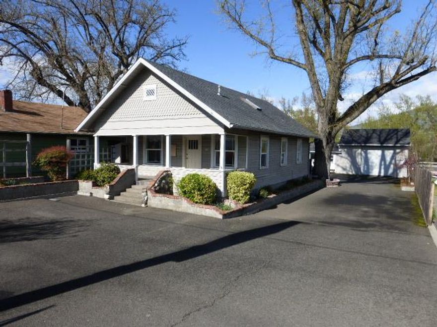 Property offers a variety of uses - retail or office with shop space. Primary building is a converted residence with 1056 sq.ft. on the 1st floor with a mezzanine. The back building has a finished office and a shop with a 12 X 12 roll up door. The shop also has a mezzanine for storage. Ideal for two separate uses or tenants. Off street parking lot is paved.