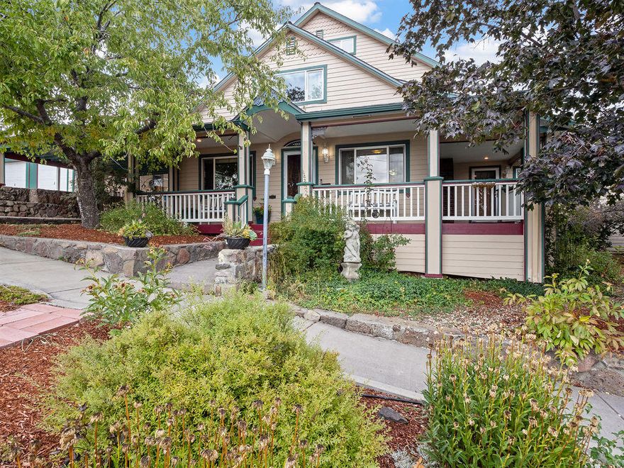 Step into timeless charm with this 4-bedroom, 3-bath Craftsman-style home offering 3,105 sq. ft. of inviting living space. Built in 1912, this beautifully maintained residence blends historic character with thoughtful updates. Enjoy classic architectural details, built-ins, and hardwood floors. The spacious layout includes two primary suites—one on the lower level with an adjoining sitting room—plus a large laundry/craft room, cold storage room, and generous walk-in closets. The updated kitchen features a 6-burner gas cooktop, granite and custom cabinetry, ideal for the home chef. Relax by the gas log fireplace or unwind on the welcoming front covered porch in this private, peaceful setting. Outside, enjoy your own backyard oasis with an inground pool—perfect for entertaining or summer relaxation. Recent improvements include a new roof installed by Linkville Roofing in 2024. A 2-car garage, two carports, and RV parking provide ample space for vehicles and hobbies.