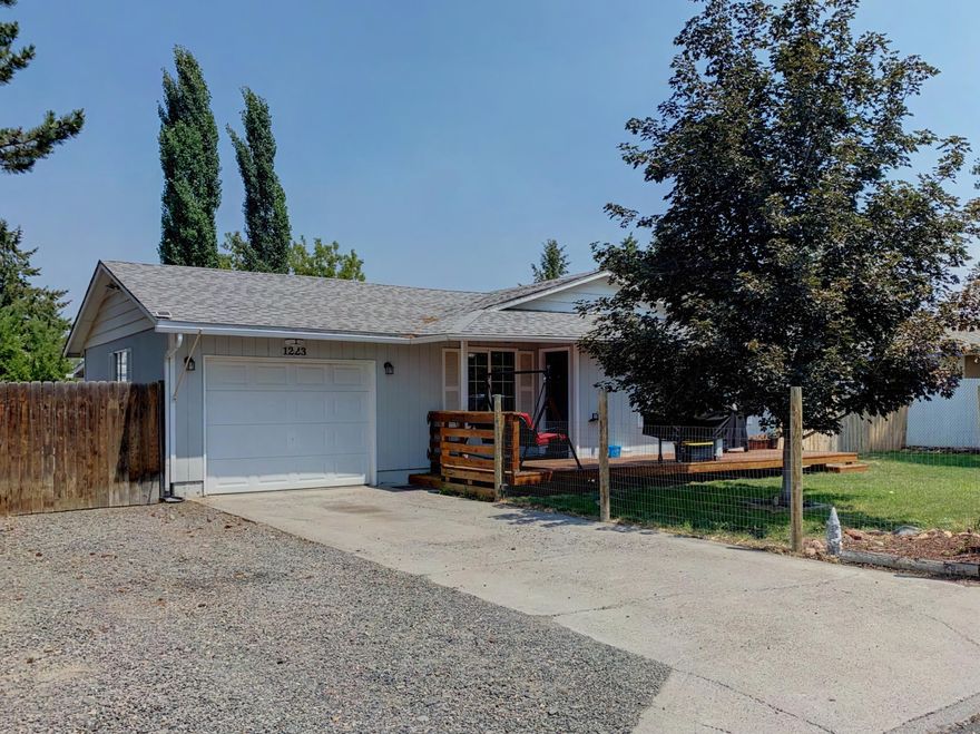 Super cute home located in an established neighborhood close to schools. Very Bright, Open Plan Appears Much Larger Than 1112 sq.ft.  Nicely updated kitchen with custom touches. Bathroom was recently update. Large family room with a wood burning stove for those cold night. RV /Boat parking, large front deck, nice landscaping, fruit trees, covered patio in the back and a storage shed.