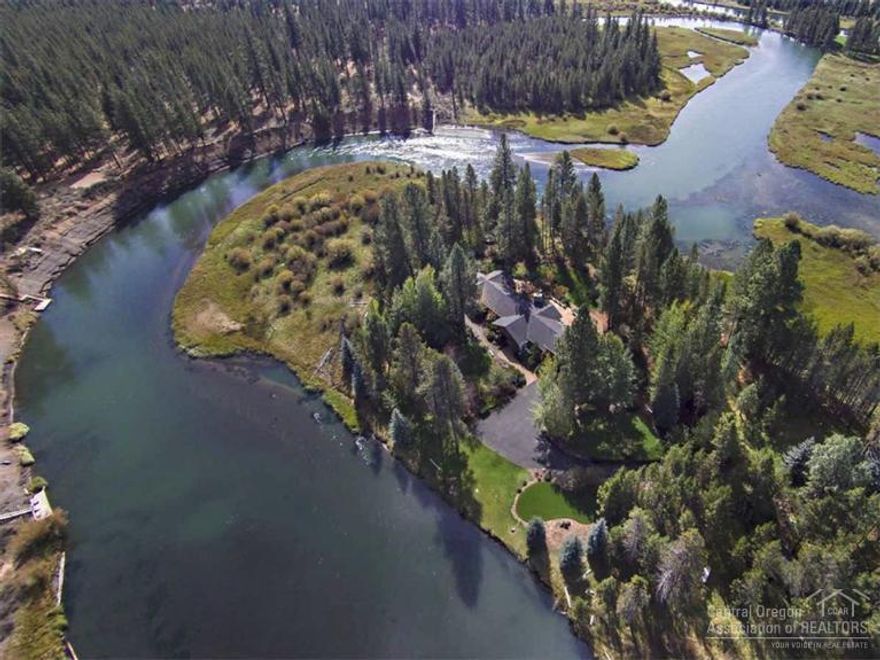 This is the riverfront home everyone dreams of. Surrounded on two sides by the big Deschutes River, this spectacular retreat looks to the water in every direction. Main level living features a gourmet kitchen, game room, sun room & spacious master suite. An additional bedroom, bathroom and family room upstairs. Situated on a beautifully landscaped 3.79 acre parcel, this home, along with a small guest cottage, boat house, dock & paved drive provide the ideal getaway or permanent home. Truly one of a kind!
