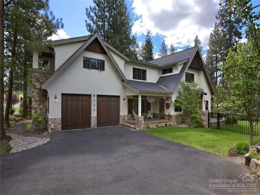 The top quality finishes & detail in this stunning, cottage-style home are sure to impress. The lower level is graced with unique myrtlewood flooring, spacious gourmet kitchen & living room with floor to ceiling stone fireplace & convenient built-ins. A true master suite features his/hers closets & a bath with jetted tub, fully tiled travertine shower w/three shower heads, gorgeous double vanity & a private terrace. Located on a flat .23 acre lot in a tranquil setting. There are 4 decks/porches off the home