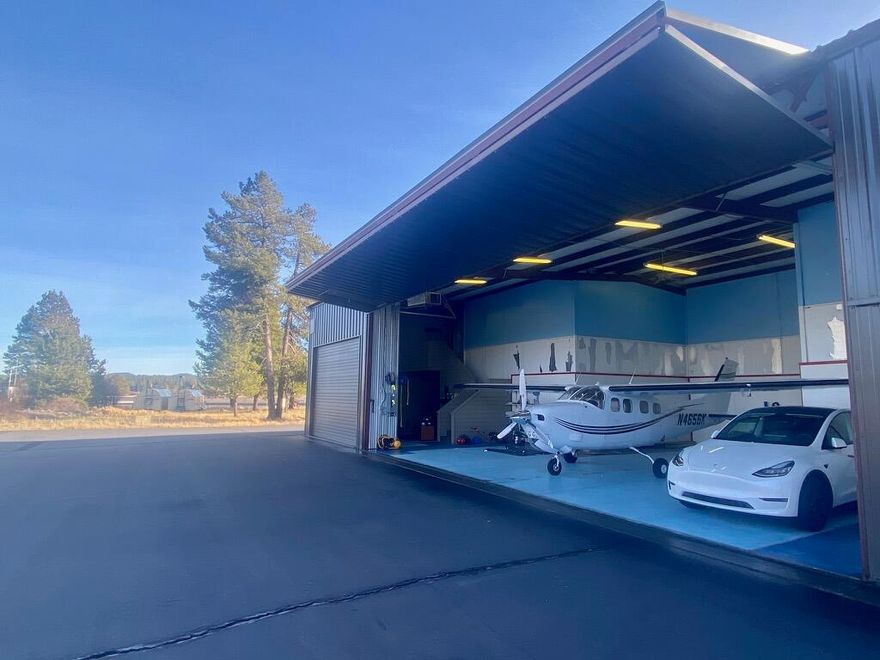 Popular end hangar/garage with lounge/office. Extra length garage (644 SF). New metal siding on building in  2015. Metal roof. Hangar Bi-Fold door is 43 ft wide, opens to 14 ft. Hangar depth 36 ft. Garage door 12 ft. Garage depth 36 ft. Hangar features an overhead electric heater, garage zone heat, baseboard heat in lounge/office. Office recently updated with new paint, carpeted stairs and engineered flooring.   Close to the Airport office. New full-length taxiway at the Sunriver Airport.