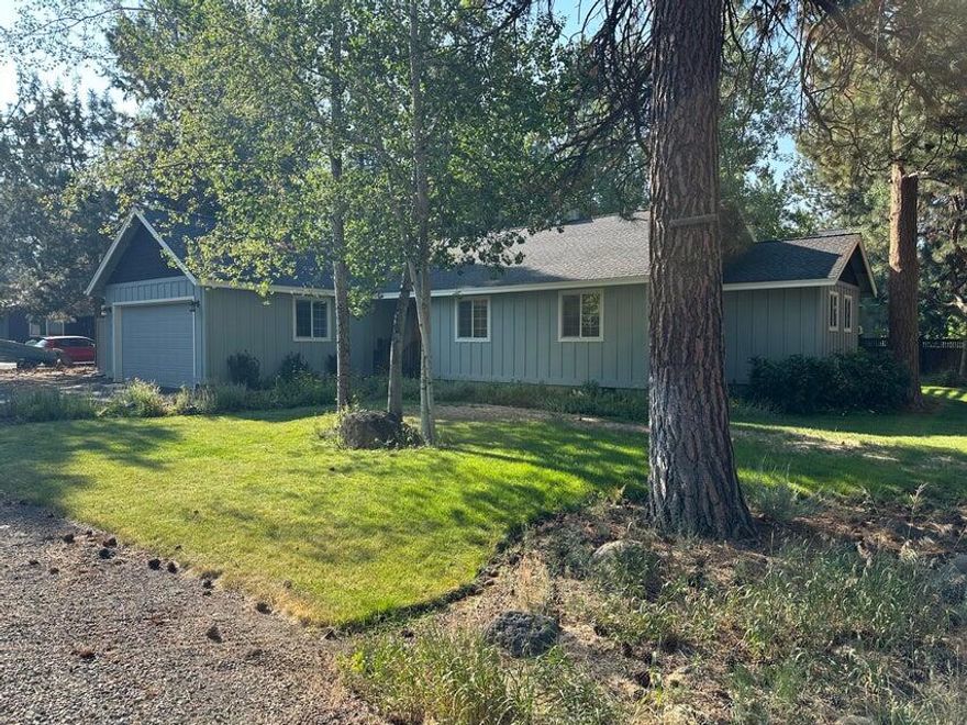 This charming single-story home is ideally located within walking distance to downtown and the scenic Peterson Ridge trail system, with a city park just across the street. Situated in the highly desirable Buck Run neighborhood on a huge .39 acre lot & zoned multi-family residential. Thoughtfully maintained, the home features hickory floors and cabinets, vaulted ceilings, and beautifully renovated bathrooms with walk-in shower and subway tile. 
The spacious primary suite offers a large walk-in closet and French doors leading to an expansive back deck perfect for entertaining or relaxing in the hot tub beneath the pergola. Enjoy year-round comfort with a heat pump, A/C & cozy wood burning stove. Additional highlights include pull-down attic access for extra storage, fenced raised garden beds, a delightful chicken coop, a separate fenced pet yard, and a garden shed.