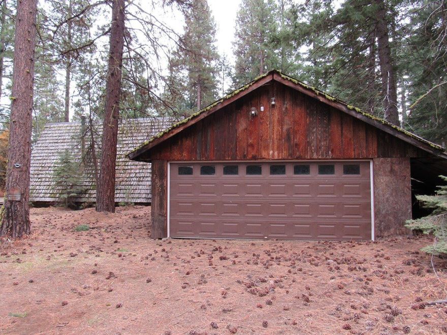 This rustic A frame cabin near Rocky Point is not far from many lakes! Surrounded by pine trees. It has a detached 2 car garage and is on .33 acres. This is a HomePath property.