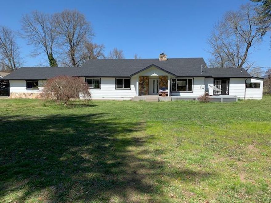 Amazing property! Hard to find, 4, flat, acres on the Rouge River, yet 10 minutes to town. Incredibly easy river access, ''like living in a wild life preserve, perfect for photography. Across the river is a farm., the views are tranquil and birds abound.

The house has been COMPLETELTY remodeled top to bottom. New roof, HVAC system, well and septic, flooring, bathrooms, appliances, extensive decking, exterior and interior painting, name it.... Two suites, each with incredible bathrooms, large tubs and amazing views.

Set back from the road, it feels like your own slice of heaven. Lovely garden space. Large 30x60, high ceiling shop space. Long driveway affords privacy. It really has it all. 

This special property is ready for it's next owners. It is truly a gem of the Rogue Valley.
