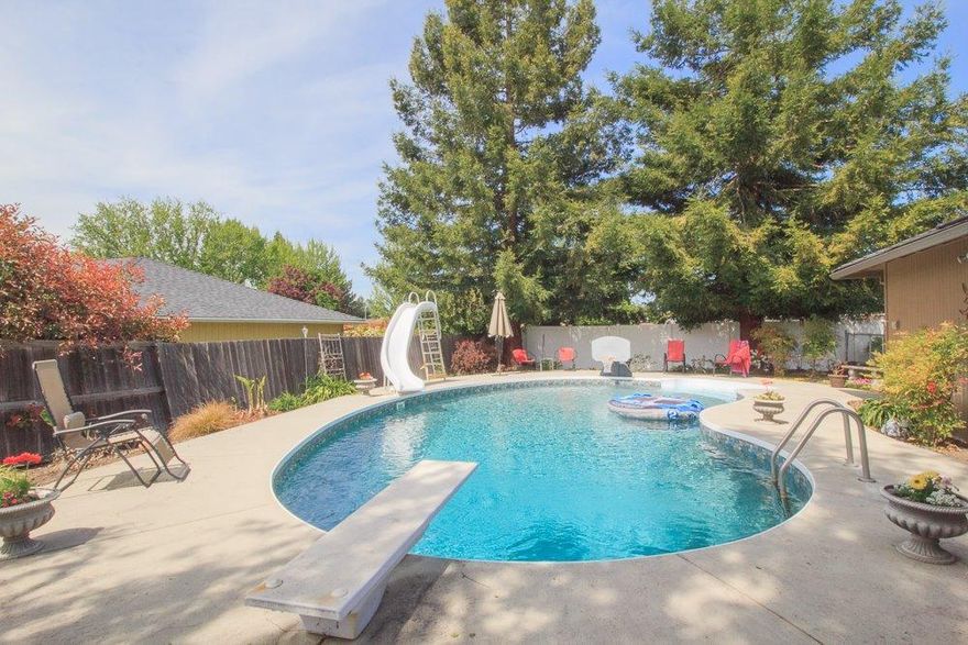 This nicely updated East Medford home has everything for a large or growing family, including a fantastic salt water pool with solar heat and a new liner, a top of the line hot tub, gated RV parking, a storage shed, extra paved parking and still room for raised garden beds and beautiful landscaping on .27 of an acre. Well maintained home offers 2644 sq. ft., 5 bedrooms, 2.5 baths, granite countertops with eating bar, new stainless kitchen appliances, tile, carpet, recently remodeled master bath and new exterior paint. Central heat and A/C system replaced 2 years ago. Located short distance from Abraham Lincoln elementary and North Medford High school.