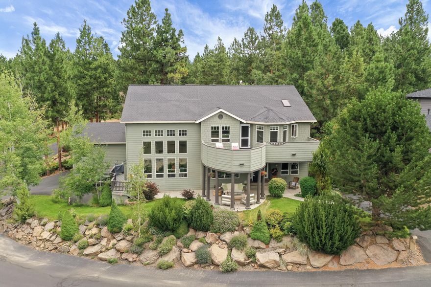 Spectacular custom home in Awbrey Court just minutes from Shevlin Park and the shops/restaurants at Northwest Crossing. Spacious great room with 28' ceilings and lots of natural light. Gourmet kitchen w/ss appliances, formal dining, one bedroom, and large office all on the main level. Extensive lighting upgrades throughout the entire home. Two car garage with a 10' door, plus separate tandem garage with shop area gives you so much room for storage!. Generous sized master bedroom has gas fireplace, seating area, enormous walk-in closet and large balcony to soak up the Cascade Mtn views. Beautiful in-law suite with full bath and separate entrance downstairs. Great floor plan with tons of extras.  Very private back yard and fantastic outdoor gathering spaces in front and back.