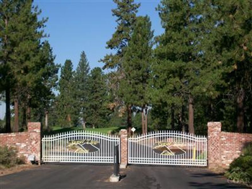 The Premiere view lot in gorgeous Sunset View Estates. Large corner parcel w/tall pines & rock outcroppings for courtyard privacy. Bordered on two sides by Common Area. Views of Lost Tracks golf course, waterfall, Mt. Bachelor, Cascade Mountains. Desirable golf & horse community with large homes. Gated for privacy.