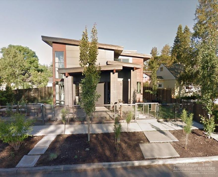 Stunning modern open-concept layout, expansive windows, w/glass garage door opening up to the outdoor living area w/firepit. Contemporary home w/main level master, solid surface counters, custom cabinetry & designer lighting, expansive hardwood floors. ADU w/& alley access. Shopping, dining & parks just blocks away.