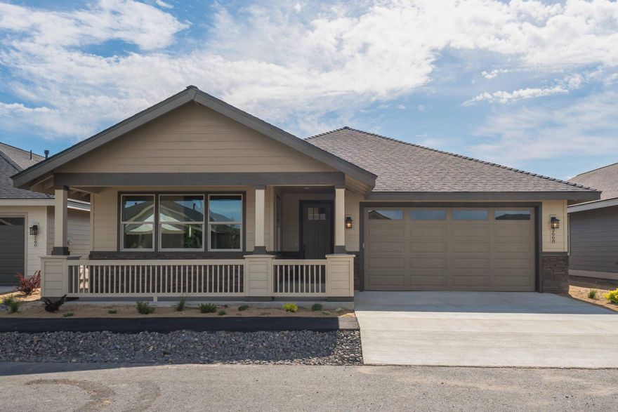 LOT 57, the Cedar floorplan in Dry Canyon Village, Central Oregon's premier age restricted 55+ gated community. The home boasts a covered front patio at it's entry, a kitchen with solid quartz counters, a 3 piece Whirlpool appliance package, an undermount sink, a breakfast nook with abundant windows and a separate dining space that is sure to fit the entire dinner party. Just off the living room is a sliding glass door that leads to a covered back patio perfect for entertaining. The master bedroom has back patio access through a glass door and its own ensuite bathroom with a mud-set tile shower. The second bedroom is perfect for an overnight guest or roommate. An upgraded trim package with fully wrapped windows, vinyl plank flooring, 8' passage doors, laundry closet and double car garage finishes the interior features. A backyard fencing option is available if you need to keep Fido in.  The community center will feature a yoga studio, pickle ball courts, indoor lap pool and more!