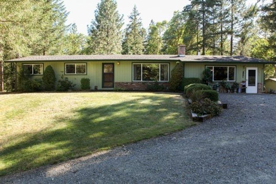 This property has a little of everything for you. There is flat pasture area and some lightly sloped hillside. A seasonal creek, fountain and wooded property provide incredible privacy. Multiple outbuildings and large (more than 1000 sq feet) 2 car garage with extra shop area. Plenty of room to park any of your toys on this property. Multiple steel carports will keep them dry and out of the sun. It gets better...the home is move in ready! All of this on more than 6 acres and only about 15 minutes from Grants Pass in the desirable West Hills area.