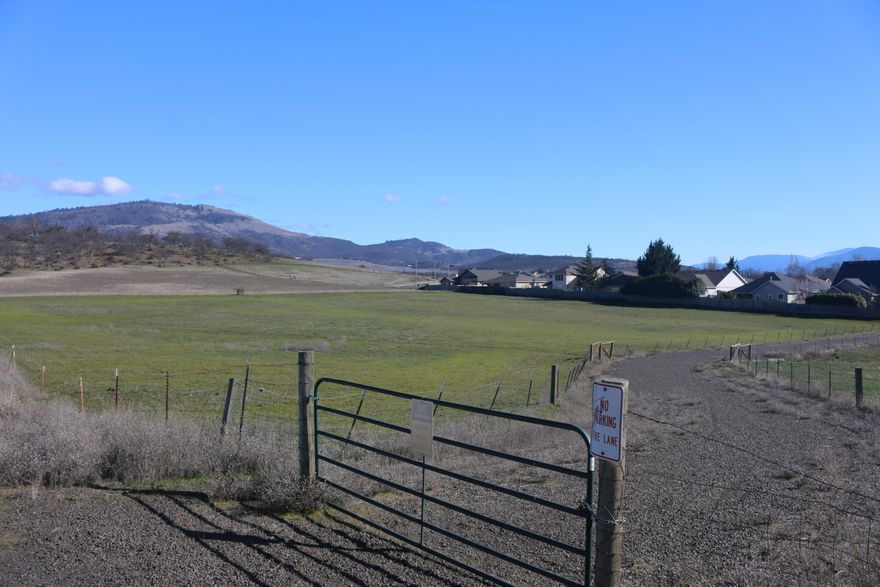 Well situated for an upper end housing development this 6.78 acre parcel sits 1300 feet from the intersection of Barnett and N. Phoenix within the city limits. Potentially 27 lots and 2 townhome lots have been discovered in preliminary plat work by subdivision of this land. Currently in a flex state zoning, SFR-00, which allows for density maneuverability. Currently abutting upscale homes on 2 sides. Opportunity is here!