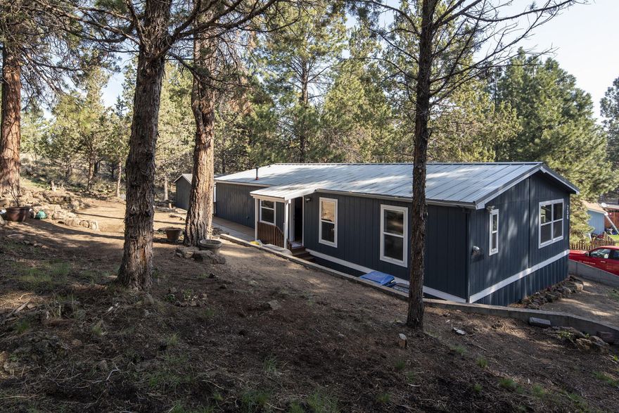 Amazing home with many beautiful features... Sellers's husband is a contractor and he has done a lot of work himself. Located in the Pines community in SE Bend, is a 3 bedroom, 2 bath Manufactured Home, with 1,344 sq ft, of living space built in 1998.  Light and bright with large windows, Osmosis system in the refrigerator, insta hot on the kitchen sink, plus additional water filtrated faucet for drinking.  Storage shed and a beautifully landscaped yard by the owner. The park area has many mature trees, pond, a playground, and paved areas for biking or strolling through the park.