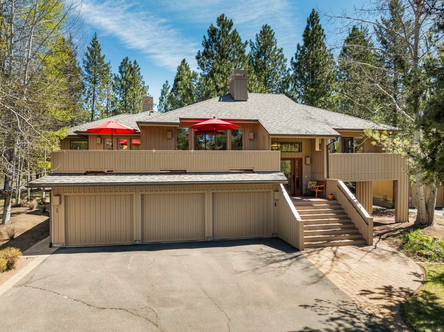 This Sunriver home on an oversized ~0.50-acre lot offers 3,900 sq. ft. of space perfect for gatherings. With 4 bedrooms (2 suites), an office, flex/5th sleeping room, family room & 4.5 baths, there's room for everyone. The vaulted great room is filled with natural light & features one of three wood-burning fireplaces (2 with gas starts). The kitchen includes granite counters, breakfast bar, Sub-Zero fridge, Thermador range, wine fridge, & 2 beverage refrigerators', 3 Bosch dishwashers, built-ins & buffet. The upstairs primary suite has a stacked stone fireplace; a second suite sits on the opposite wing. Downstairs offers a family room, see-through fireplace to an office with wood accents, 2 guest bedrooms, 2 baths & a flex room with Murphy bed. Nearly every room opens to an expansive deck. New roof, Trex decking, hot tub, dog run, 3-car garage. In close proximity to bike paths, river, marina, village & all Sunriver amenities!