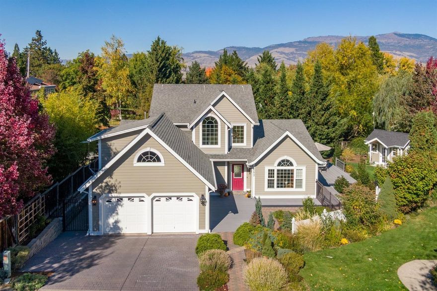 Peaceful, Tranquil, Beautiful! This lovingly appointed, one-owner property offers a great, close-in Ashland neighborhood near walking trails and natural vistas. The light and spacious home blends classic and contemporary styling with oak plank flooring, Italian tile kitchen and country French bar, beautiful custom trim work and light fixtures, gas fireplace with classic mantle, main level master suite with jetted tub and separate shower, stone countertops in the baths, two sizeable second floor bedrooms, big den/office space PLUS superior storage throughout. Lots of high-quality upgrades too, including new Hardi-plank siding, new gutters and guards, wrap around composite decking, and a new custom garden cottage. The nicely private lot has TID rights, large trees, extensive stonework, backs onto babbling Paradise Creek and accesses from both Peachey and Ross Lane, with extra parking and a rolling security gate at the back. Hard to imagine a more meticulous and stylish home than this!