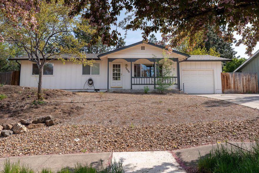 Beautifully updated home located in a wonderful neighborhood with large lots and old growth trees. The property backs to Hollinshead Park with a gate to access this gem of a park in the middle of NE Bend. This property has been nicely updated with new kitchen appliances, countertops, and finish work throughout. The roof, flooring, and fencing are also fairly new. The backyard is fenced, has raised garden beds, a sprinkler system, and a nice patio to enjoy dinners, coffee, birds chirping, and gardening to your delight. There is room to place a boat, small RV, or extra toys beside the one car garage, as well. Cozy up in front of the gas fireplace and read a book. This lovely property has everything you need for a nice life in Bend Oregon.