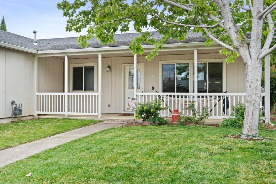 Well cared for single level home on a private gated lot, in town close to schools and shops! This 3 bedroom 2 bath offers an open concept design with a gas fireplace, french doors, built-in shelving, vaulted ceilings, a spacious kitchen with an island, and a well designed floor plan with newer flooring and an abundance of natural light. The fully fenced property offers privacy, low maintenance mature landscaping, a covered porch, and plenty of parking. Step into the garage to find a workshop that leads into a large laundry room and hall storage. This home has been lovingly maintained and it shows. Motivated sellers.