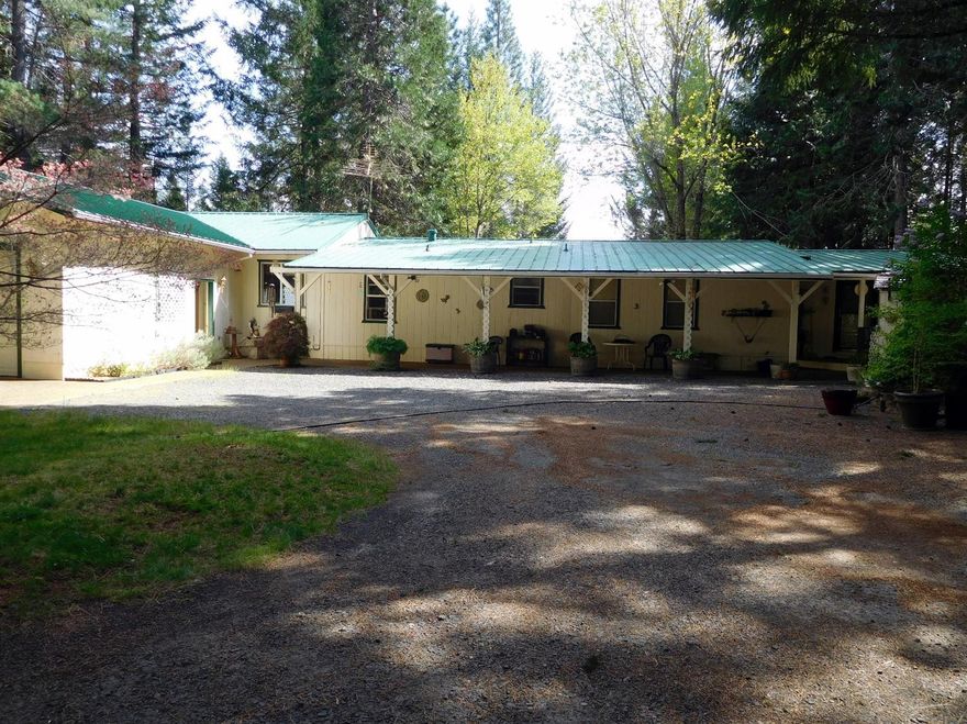 Beautiful property, that includes a beautiful home. this home offers so much in diversity and beauty alike. Step saving kitchen, laundry close by, with a sep. utility room. Bay windows in the dining area in kitchen to view the outdoors all natural surroundings. Deck off utility room,is fairly new.Lots of storage for the kitchen area too. Nice sized formal living room, bay windows, room for an entertainment center and door to another ext. deck, view of back yard area towards the fenced garden area. Then there is a spacious master bedroom and bath, with large walk in closet. The remodel in 1997, added a room (that has a closet) that is used as a craft, office space, and a great room that is very large, 2 ceiling fans in it, bay windows, plus attached is the double car garage. Land is all level, wooded, lots of landscaping, covered porch/patio area in front of home, ornamental trees, shrubs. Also fenced area for a horse and small lean-to. SO MUCH MORE!!