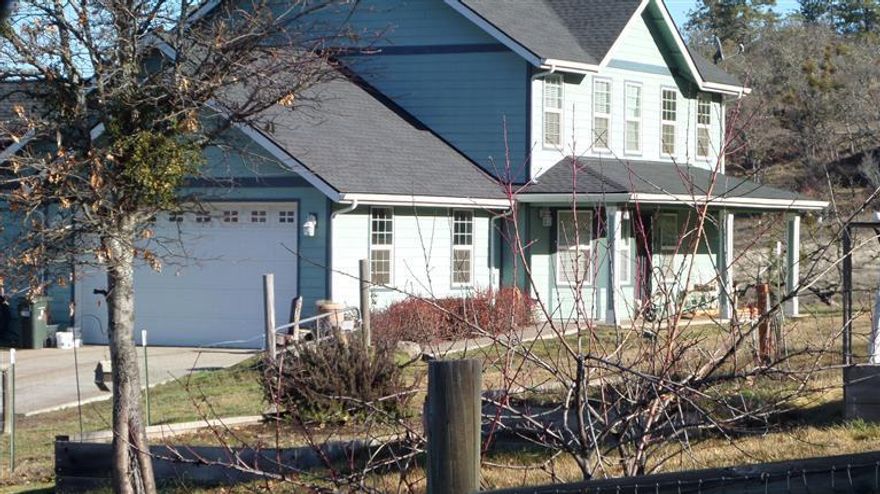 Beautiful newer custom built home on 7.68 irrigated acres. Area of beautiful newer homes. Spectacular views! Located down a quiet country lane. 1st time on market. Lower lever has open floor plan with formal dining room. Granite counter tops, River Rock fireplace insert, and master bedroom with walk in closet master bath with walk-in shower. Upstairs has a full bath with a great room and 2 more bedrooms. Property is all fenced and crossed fenced, ready for your live stock. Several out buildings and lean-to horse shelters. Year round pond and more!