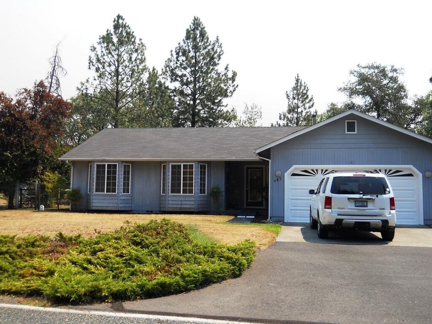 Small acreage rural living yet only about 5 miles to I-5! Nicely appointed contemporary home with 3 bedrooms, 2 baths, 1588 SF on 2.78 acres. The house features granite counters in the kitchen and baths, newer appliances, large pantry, cherry hardwood floors, updated light fixtures and bathroom fixtures, walk in closet in primary bedroom, and vaulted ceilings in living room. Outside there's numerous outbuildings including a 1024 SF shop, fruit trees, grapes, fenced and cross-fenced with Jump Off Joe Creek running through it.