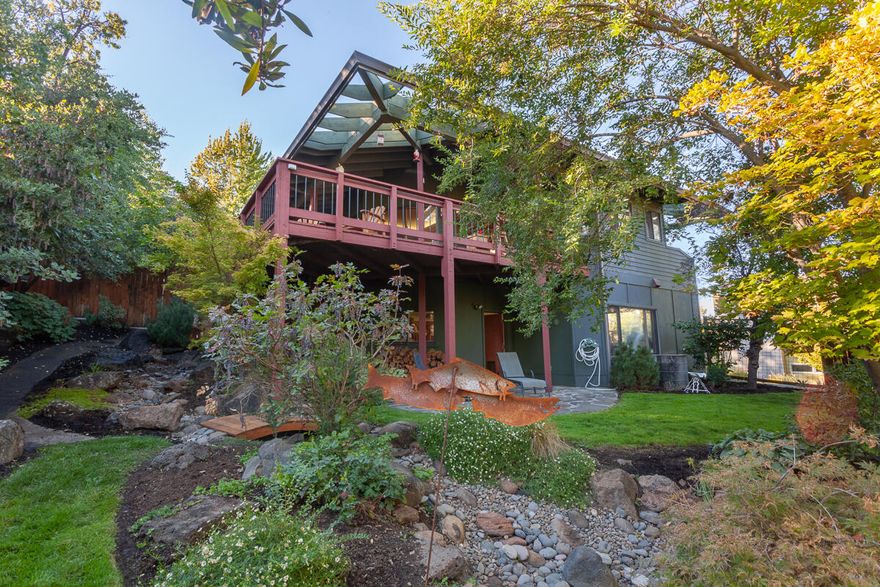 Best location for this gracious, beautifully, and extensively remodeled contemporary home, just minutes to the Plaza and Lithia Park! Private, quiet setting, with stunning views on .39 acre. All living is on the main level. Plus, new owner parking added, adjacent to the main level, for easy access. Amenities include interesting architectural features; high or vaulted, wood ceilings; walls of windows for maximum light; hardwood and stone floors; a chef's kitchen; a spacious living room with slate fireplace; a separate dining room; and 3 bedrooms, each with an en-suite bath. The property has its own irrigation well to keep everything lush and green, a water feature and multiple new decks and a hot tub/gazebo for prime outdoor living!