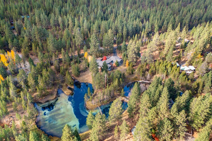 A once-in-a-lifetime opportunity to own one of few Riverfront properties on the Headwaters of Spring River. Natural Springs create a unique ''lake'' that feeds into Big Deschutes. Imagine waking up with the sun, stepping out your back door to fly-fish, SUP & enjoy the birds and wildlife. 15 minutes to Mt. Bachelor for world class skiing, snowboarding & Nordic. Surrounded by 4 award-winning golf courses. Incredibly well planned construction with dual master suites on main living level complete with a geo-thermal efficient radiant floor heat/cool. Recently updated brand new kitchen & appliances. Separate living quarters in the Casita. Complete with wood-working shop with dust free vacuum system. The last residential road bordering Deschutes National Forest Land for access to hundreds of trails for hiking, biking, dirt-biking, etc.. 5 mins to Sunriver Village and Resort for all your luxury amenities including Sage Springs Spa, groceries, dining, the SHARC. This is truly a special place!