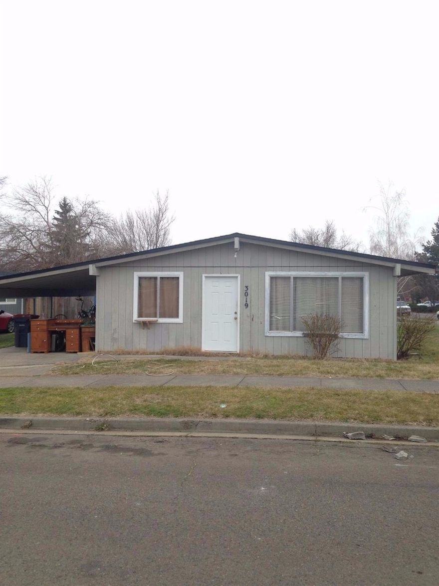 Older duplex in good East Medford location. Close to shopping, schools, doctors offices and backs up to the Centennial Golf Course property. Both units are 3 bedroom, 1 bath, have a 1 car carport for each unit. New flooring in both units. Another duplex , across the street, just like this one is also available for $195000.