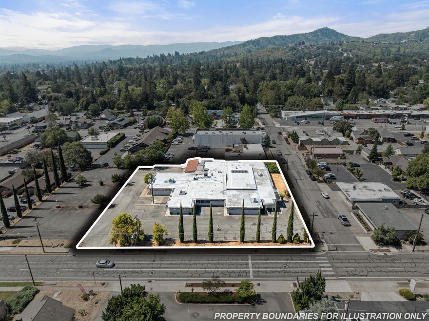 Prime medical/professional office in Grants Pass w/15,978 SF main bldg + 720 SF modular on 1.13 AC GC-zoned lot. Built in the 1950s w/mid-century design & expanded in 1976, the property features abundant natural light via skylights & transom windows, an atrium, spacious lobby, multiple exam rms (most w/sinks), 3 ADA restrooms, upgraded HVAC, fiber optics, dbl ADA entry, 7 exterior doors, pharmacy space & fenced courtyard. Located on NE 7th St, one of GP's busiest corridors, the site offers excellent visibility, multiple ingress/egress, and ample on-site & street parking. Surrounded by established healthcare providers, counseling centers & social svc offices, the property is in a thriving med. hub, ideal for continued healthcare or admin uses. The site is within a federally designated Opportunity Zone, offering potential tax benefits, and benefits from proximity to I-5, US 199, OR 99 & 238, providing strong regional access to Medford, Roseburg & beyond. A rare, well-located opportunity