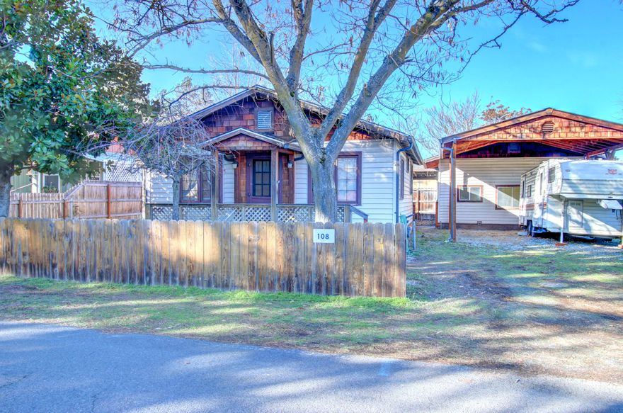 Cute cottage style home in Phoenix. This one bedroom, one bath home features a specious living room, an enclosed covered patio off the bedroom, a large private covered back porch great for everyday living or for hosting gatherings. There is a bonus room in the detached shop, a covered carport with plenty room for RV parking. The easy care back yard has raised garden beds. Come see today.