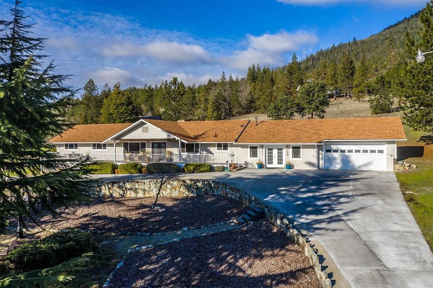 Comfortable country living at its finest!!! Located in the desirable Colonial Valley this home was extensively remodeled in 2019 with attention to detail throughout! Featuring a 3 bed 2 1/2 bath home with 2,500sqft two car attached garage & covered front porch to soak in those sweeping views and sunsets. Inside you'll find an open bright and modern concept with gorgeous bamboo flooring, rock fireplace, beautifully redone kitchen w/stone coat countertops. Master bedroom including a private balcony & en-suite w/walk in tile shower, updated guest bathroom, generous laundry room w/ sink. Potential for huge second master or office/craft room with its own private entrance. Outside you'll find a circular driveway, RV Parking w/ hookups, partially fenced backyard w/ pergola and plenty of room for a vineyard, horses or..? All this on 1.94 acres with quick access to I-5 & town, low county taxes and great water. Schedule your tour today and experience this peaceful setting for yourself!