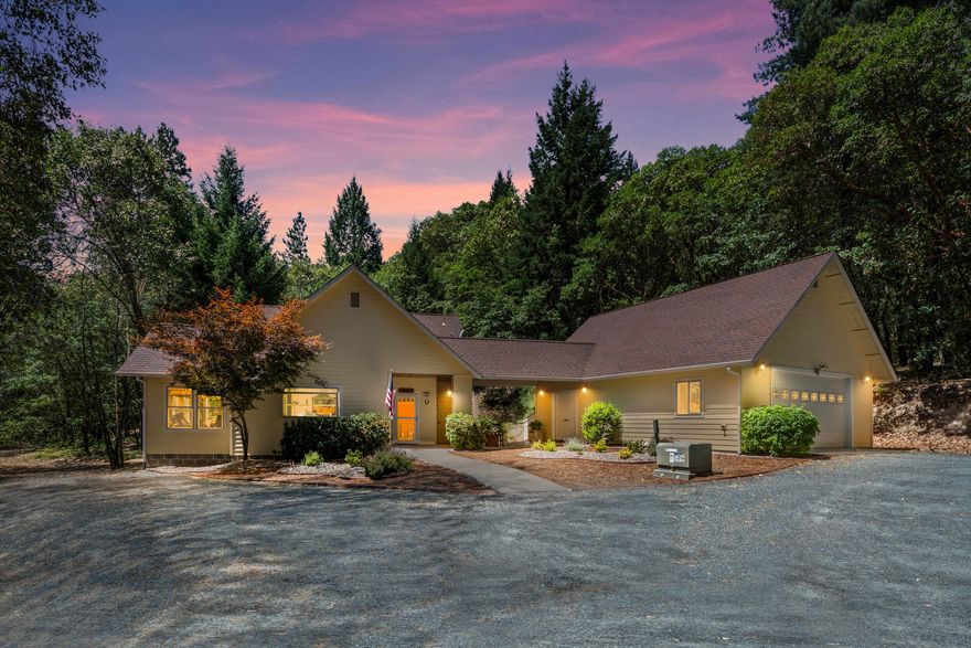 Situated at the end of a private maintained road, this turn-key home is ready for those seeking peace, privacy and a tranquil setting. Enjoy 60 acres of mixed marketable timber, backing to BLM land, and just minutes from downtown Grants Pass. This one-owner estate offers a spacious chef's kitchen with granite countertops, gas cooktop, double oven, and abundant storage. The first-floor primary suite bathroom includes a warming dryer, soaking tub, and heated floors. This natural light-filled home features new interior paint and plenty of room to entertain while providing guests with comfort. The large 2-car garage includes a separate workshop with heating & A/C. In addition, it has seasonal creeks, raised garden beds, fruit trees, and plenty of room for your outdoor activities. Sit on your deck or enjoy relaxing in the hot tub while taking in the surrounding beauty and silence as you have no neighbors on this side of the community. This true Oregon sanctuary is ready for its new owner!