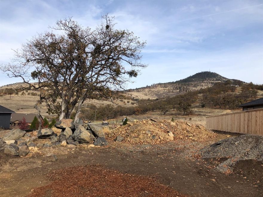 Incredible View Lot - Fairly Flat and Ready to Build Now! Don't miss this opportunity to build your dream home on this shovel-ready lot for sale in Medford's premier subdivision: Bella Vista Heights. Unlike most developments in East Medford, there is NO minimum building square footage requirement, all building designs to be approved by the Architectural Control Committee. Bring your own builder or complete a new custom home with Brian Magel Construction on this fabulous lot.