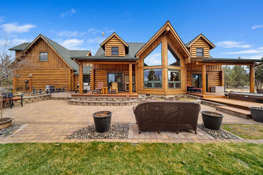 Gorgeous, meticulously maintained, custom log home on 11 acres in Juniper Ridge, one of the premier neighborhoods in Central Oregon. Bright and airy home with primary suite on the main floor, flex space throughout, great room and gorgeous kitchen! Solid counters, social island bar seating, stainless steel appliances, gas stove and imported stone floors make this kitchen a wonderful entertaining space.  This home also has a very large detached shop as well. Window filled walls with peekaboo views of the Cascades bring tons of light into the living  area. Primary suite offers spa inspired bath with lounge tub, separate shower, dual vanities and expansive walk-in closet.  Guests are sure to enjoy the spacious living area, luxe bath and two large bedrooms upstairs. 3 car garage and ample storage for activity gear. Located just minutes from Bend with quick access to golf, dining, hiking, schools and surrounding areas.