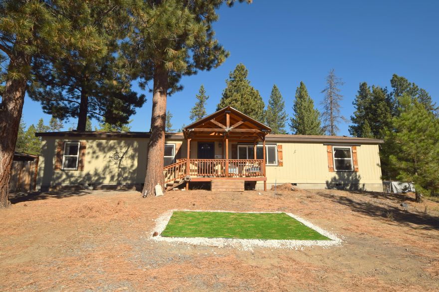 Country living at it's best! Large 2000 manufactured home that has 1782 square feet, 3 bedrooms and 2 full baths. Open floor plan. Stainless steel newer kitchen appliances.  Enjoy the Central Oregon life style on this large .97 acre lot with the private fully fenced back yard, large deck, fire pit and chicken coop. Covered front deck and detached single car garage. Unlimited recreational possibilities with being near Sunriver, La Pine State Park and Mt. Bachelor. Start your Central Oregon Adventure today!