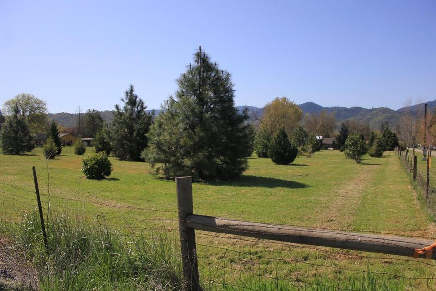 Looking for gorgeous park-like SPACE?!? Look no further! This adorable mini-farm is all on flat usable land the 1950's home has a lot of the upgrades already done or started, would be a PERFECT home to let your inner Joanna Gaines out & come add the finishing touches! Home features a ton of the big-ticket items already completed with a new roof, most of the siding & exterior paint in 2018, newer dual pane vinyl windows, new in 2018 vinyl in sun room and kitchen, recently updated bathroom and newer dishwasher. The home has so many charming little spaces that can be used for a sun room, perhaps and extra room, a laundry room or...? One of the bedrooms has hardwood floors under the carpet. Property has a well that produces over 130GMP when last tested. There is a seasonal creek, a koi pond, a pole barn, a large older shop, a chicken coop and SO much more! Too much to list but come check this property out because it wont last long.