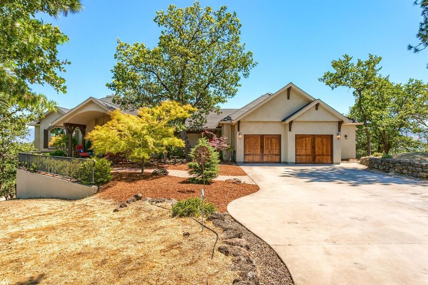 Stunning Mediterranean style home with panoramic valley views & end of the road privacy. Just minutes to Jacksonville, this well-appointed home features a grand entry w/expansive great room, large formal dining & a wonderful den/library. Wide plank distressed Oak & Slate floors, 9 & 10ft open beam ceilings, 3 fireplaces & custom built-ins throughout. The center island kitchen offers Corian counters, GE Monogram commercial gas range & hood w/convection oven, double dishwashers & walk-in pantry. The main floor private master suite features a cozy sitting room w/see-through gas fireplace, large walk-in closet & comfortable master bath w/double vanity, jetted tub & separate shower. Expansive rec room downstairs w/sun room, 2-additional bedroom suites, guest bath & large bonus room ideal for media room or artist studio. Beautifully treed this property offers views in every direction with a paved walking path, cobblestone patio, covered deck and an oversized 2-car garage w/workshop area.