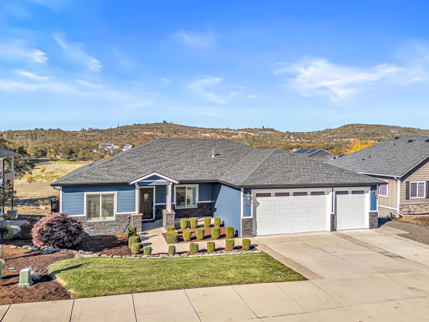 Amazing Location • Incredible Unobstructed Views • Single Level • 3-Car Garage • Too Many Upgrades & Extras to List All • MUST TOUR! Excellent split bedroom floor plan with potential for dual primary suites or a perfect mother-in-law setup, all on one level. This stunning custom home showcases top-quality craftsmanship throughout, with nearly every upgrade imaginable. Features high-end real wood engineered floors, white cabinetry, quartz countertops, and premium stainless steel appliances including the refrigerator. The open concept living area offers a gas fireplace, custom shutters, and an incredible deck perfect for entertaining or relaxing. The luxurious primary suite has beautiful mountain views, double coffered ceilings with crown molding, soaking tub, tile shower, bidet, and oversized walk-in closet. Finished three-car garage, central vac, low-maintenance landscaping, garden area, and a huge bonus room below for storage or potential living space. Truly amazing.