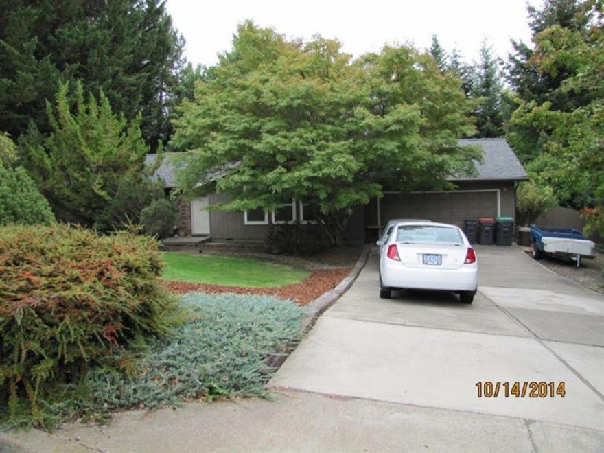 Very private, well maintained East Medford home situated on 0.37 of an acre. 3 large bedrooms, 2 1/2 baths, formal living room which opens up to the dining room. Family room with nice, real wood burning fireplace. Large kitchen with island, nook, custom cabinets with pull-outs, lazy susan and the pantry is all custom too. New cooktop, wall oven, and hood. Large office which could be a 4th bedroom. Indoor laundry with storage and a large deck overlooking the mature back yard. Also, 2 small sheds.