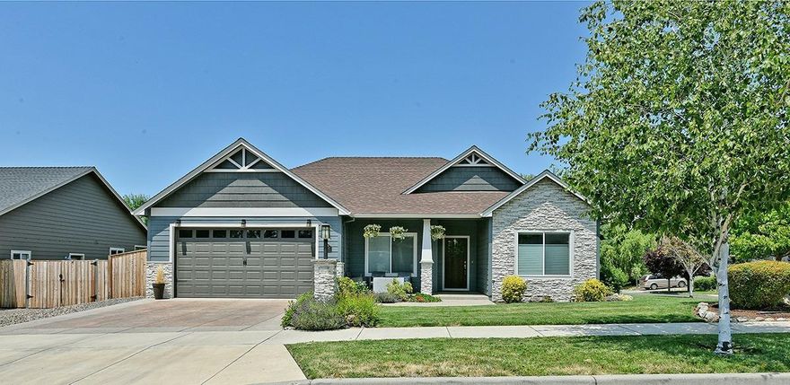 Exceptional home in highly desirable East Medford neighborhood. New exterior paint and custom stonework give the home beautiful curb appeal. Enjoy the view of Roxy Ann from your own front porch. Open floor plan is perfect for entertaining. Living room is warm and inviting with gas fireplace, lots of natural light and custom ceiling color. Kitchen features granite counters, gas stovetop and stainless appliances. Dining area has striking wood accent wall with an inlay of the State of Oregon. Spacious master suite has dual vanities, jetted tub, separate shower & large walk-in closet. Two nice sized guest bedrooms and guest bathroom concludes the interior. Fantastic backyard with covered patio & large deck is ideal for summer barbeques. Call today for your own personal tour.