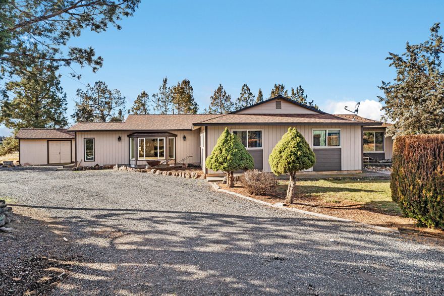 Peaceful country living awaits on this 2-acre property at the end of a quiet street. The 3-bedroom, 2-bathroom home features both a living room and a separate family room, offering flexible space for relaxing or entertaining. A brand-new roof was installed in 2025, giving peace of mind for years to come. Outside, you'll find a massive covered parking area large enough for two RVs, a barn with an attached corral, a separate hobby barn, and a tranquil pond area. With 1 acre of water rights, room for animals, projects, or gardening, this property combines comfort and functionality in a private, serene setting.